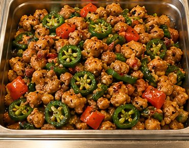 Spicy chicken in a steam-table pan