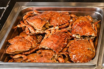Whole crab in a steam-table pan